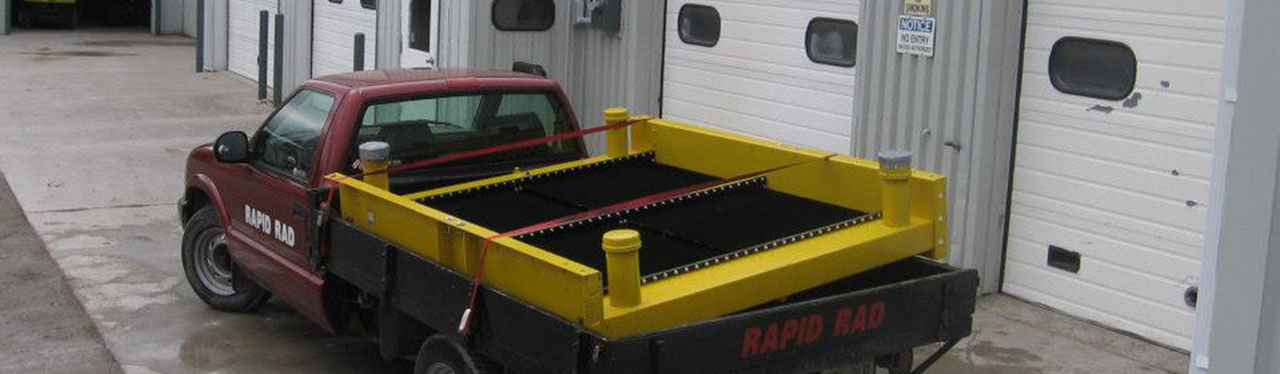 Rapid Rad truck carrying a large truck radiator built by heating & cooling specialists