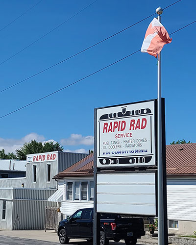 sign outside of Rapid Rad Service advertising fuel tanks, heater cores, oil coolers and radiators